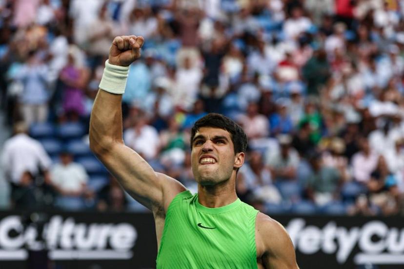 Spain's Carlos Alcaraz celebrates a point against Germany's Alexander Zverev during their men's singles semi-final match on day thirteen of the Australian Open tennis tournament in Melbourne on January 30, 2026.  IZHAR KHAN / AFP