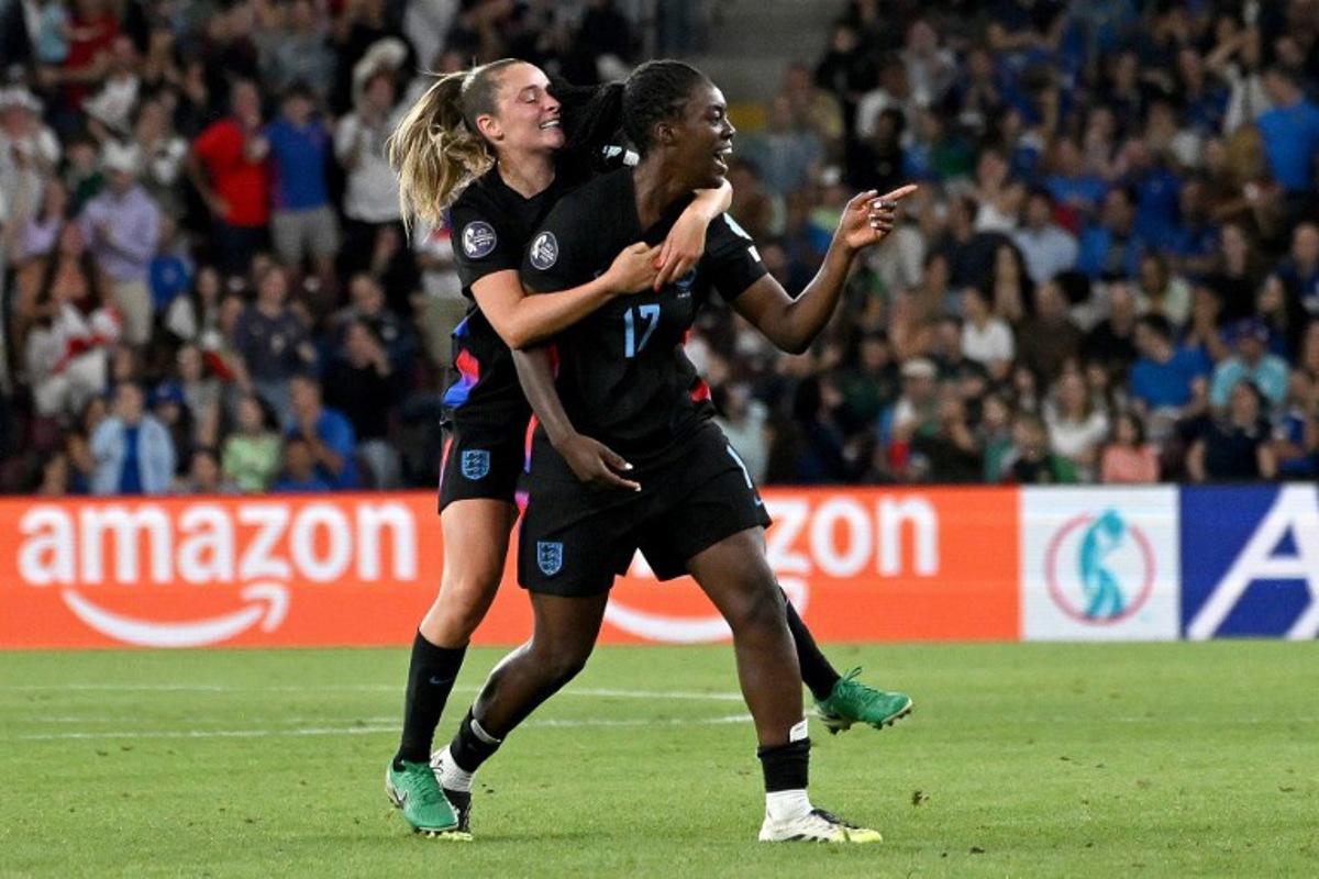 England's forward #17 Michelle Agyemang (R) celebrates with England's midfielder #10 Ella Toone (L) after scoring a goal during the UEFA Women's Euro 2025 semi-final football match between England and Italy at the Stade de Geneve in Geneva, on July 22, 2025.  Miguel MEDINA / AFP