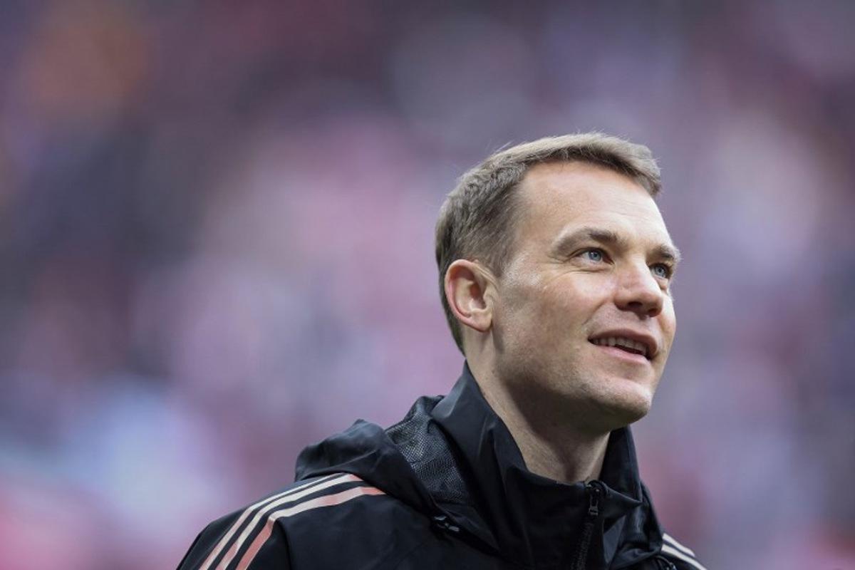 Bayern Munich's German goalkeeper #01 Manuel Neuer smiles after the German first division Bundesliga football match between RB Leipzig and FC Bayern Munich in Leipzig, eastern Germany on May 3, 2025.  Ronny Hartmann / AFP