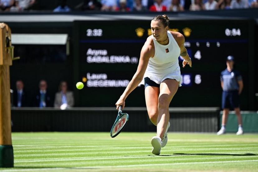 Belarus's Aryna Sabalenka returns the ball to Germany's Laura Siegemund during their women's singles quarter-final tennis match on the ninth day of the 2025 Wimbledon Championships at The All England Lawn Tennis and Croquet Club in Wimbledon, southwest London, on July 8, 2025.  Kirill KUDRYAVTSEV / AFP