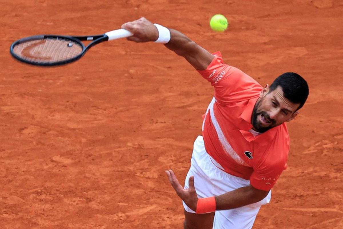 Serbia's Novak Djokovic serves to Chile's Alejandro Tabilo during the Monte Carlo ATP Masters Series Tournament round of 32 tennis match on the Ranier III court at the Monte Carlo Country Club in  Roquebrune-Cap-Martin on April 9, 2025.  Valery HACHE / AFP