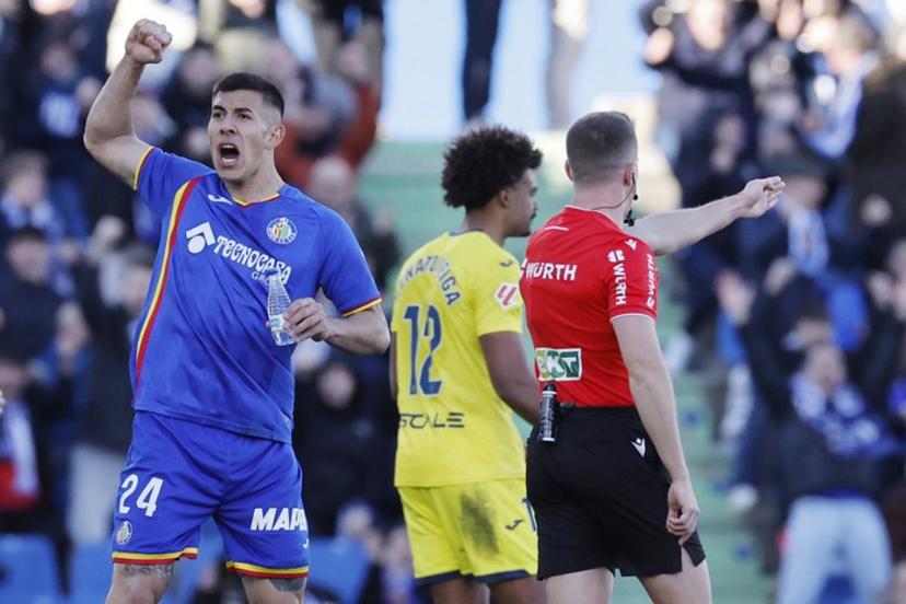 Getafe's Argentine defender #24 Zaid Romero Player celebrates as referee awards penalty against Villarrea during the Spanish league football match between Getafe CF and Villarreal CF at Coliseum Alfonso Perez Stadium in Getafe on February 14, 2026.  Oscar DEL POZO / AFP