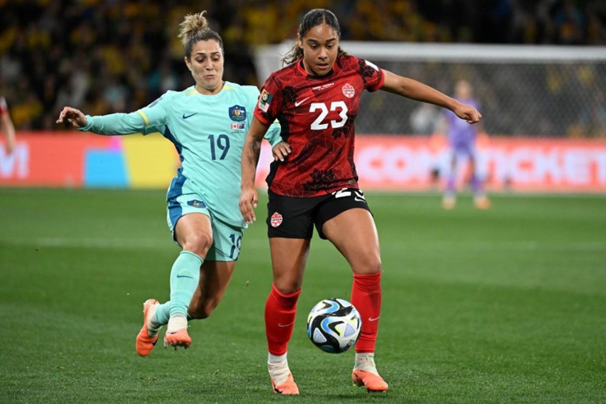 Australia's midfielder #19 Katrina Gorry (L) fights for the ball with Canada's forward #23 Olivia Smith (R) during the Australia and New Zealand 2023 Women's World Cup Group B football match between Canada and Australia at Melbourne Rectangular Stadium, also known as AAMI Park, in Melbourne on July 31, 2023.  WILLIAM WEST / AFP