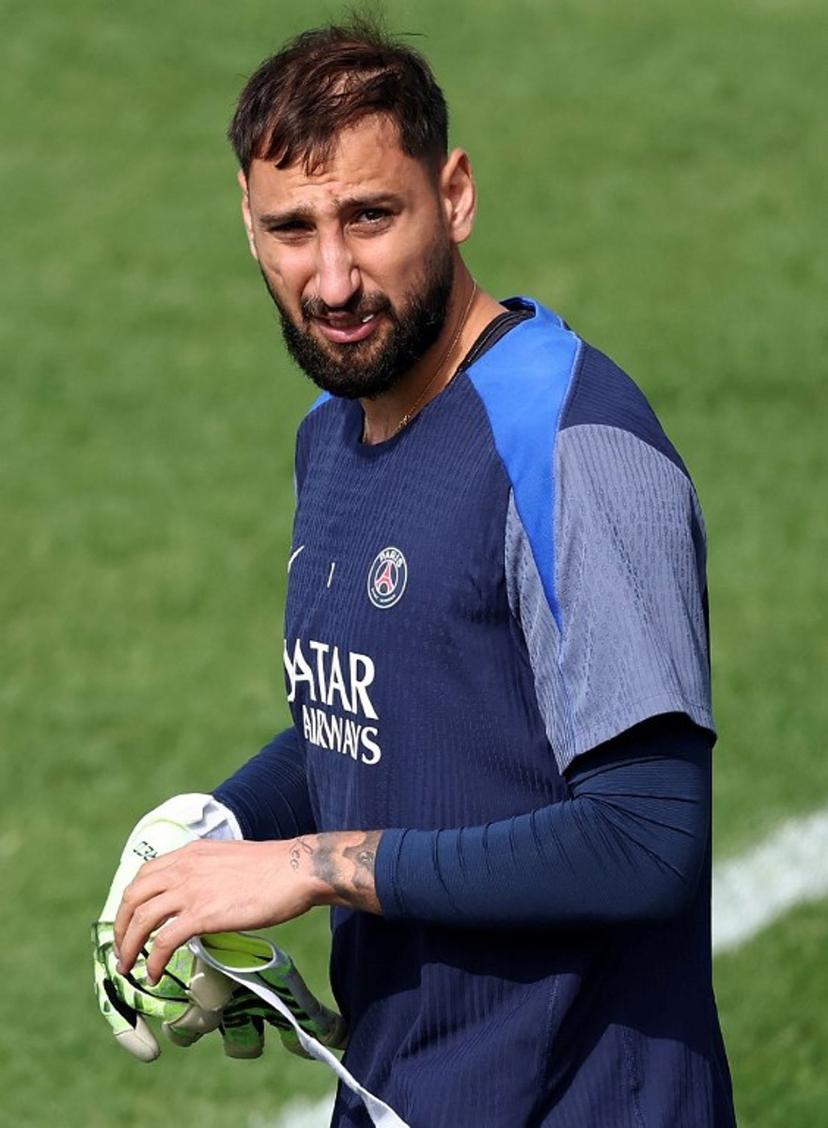 Paris Saint-Germain's Italian goalkeeper Gianluigi Donnarumma arrives for a training session at French L1 Paris Saint-Germain (PSG) football club's training ground at Poissy, north-west of Paris on August 21, 2025, on the eve of the L1 football match PSG against SCO Angers.  FRANCK FIFE / AFP