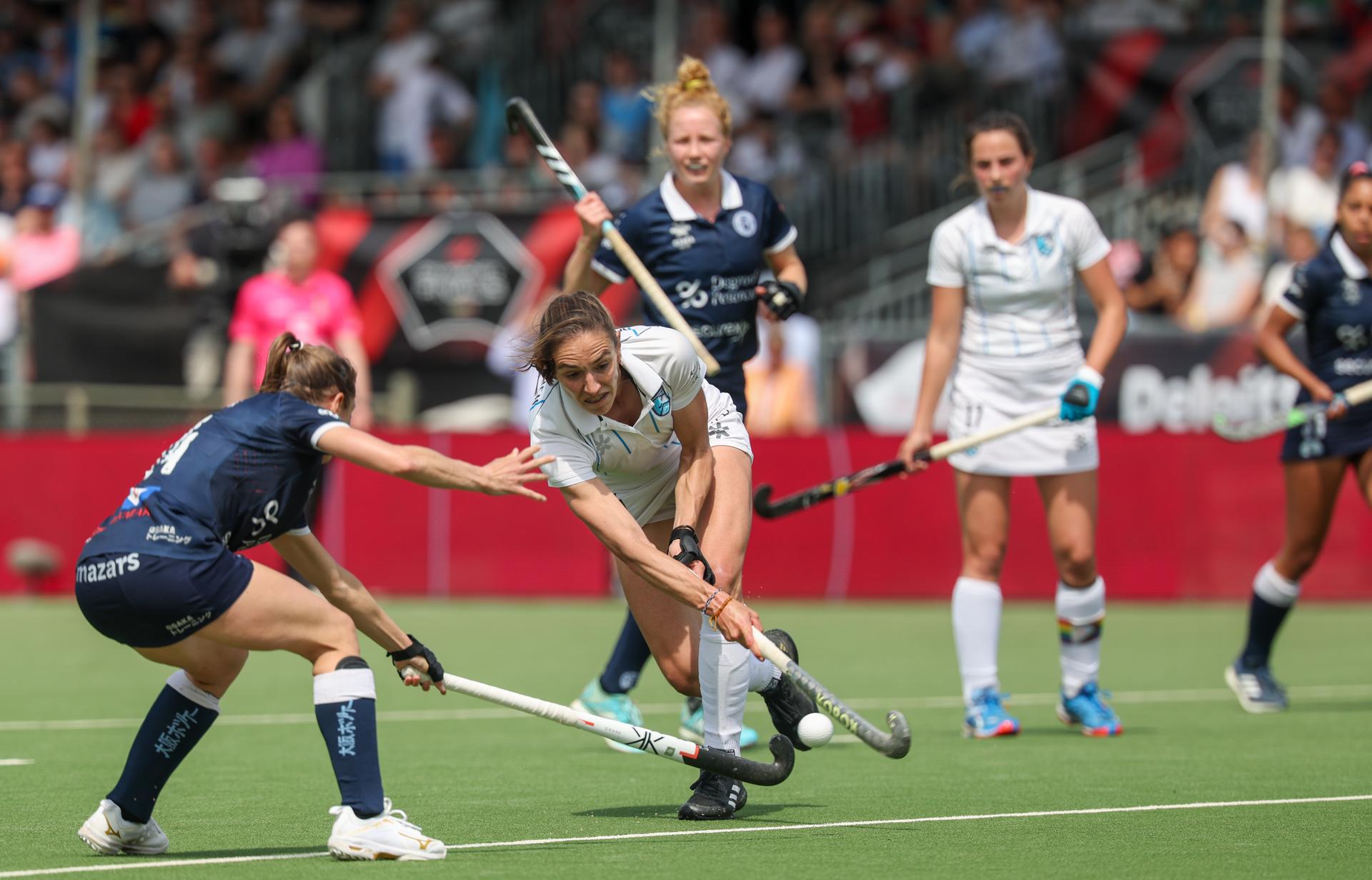 Braxgata's Judith Vandermeiren fight for the ball during a hockey game between Gantoise and Braxgata, Sunday 12 May 2024 in Antwerp, the return leg of the finals of the playoffs in the Belgian Hockey League women during the 2023-2024 season. BELGA PHOTO VIRGINIE LEFOUR