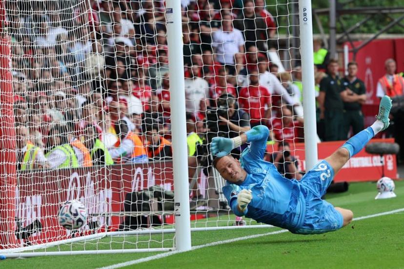 Nottingham Forest's Belgian goalkeeper #26 Matz Sels fails to stop a shot from Leeds United's German midfielder #18 Anton Stach as Leeds score a late winner during the English Premier League football match between Nottingham Forest and Leeds United at The City Ground in Nottingham, central England, on August 22, 2026.  Darren Staples / AFP