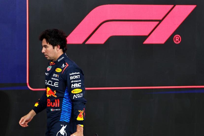 Red Bull Racing's Mexican driver Sergio Perez walks to his garage after the qualifying session ahead of the Abu Dhabi Formula One Grand Prix at the Yas Marina Circuit in Abu Dhabi on December 7, 2024.  HAMAD I MOHAMMED / POOL / AFP