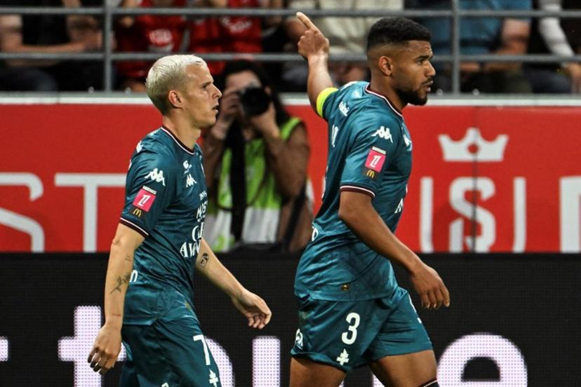 Metz's French defender #03 Matthieu Udol (R) celebrates after scoring a goal during the French L1-L2 playoff second leg football match between Stade de Reims and FC Metz at Stade Auguste-Delaune in Reims, northern France on May 29, 2025.  FRANCOIS NASCIMBENI / AFP