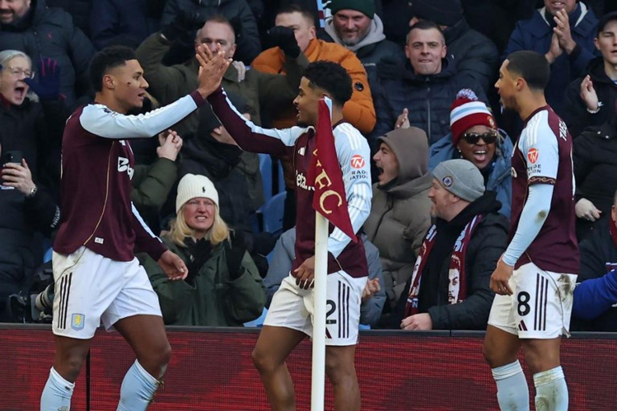 Aston Villa's English striker #11 Ollie Watkins (L) celebrates with teammates after scoring the opening goal of the English Premier League football match between Aston Villa and Nottingham Forest at Villa Park in Birmingham, central England on January 3, 2026.  Darren Staples / AFP