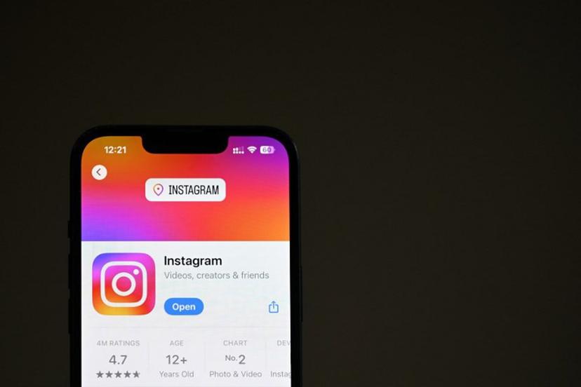 An illustration photograph taken on April 17, shows the Instagram app in the App Store displayed on a phone screen, in a residential property in Guildford, south of London.   Justin TALLIS / AFP