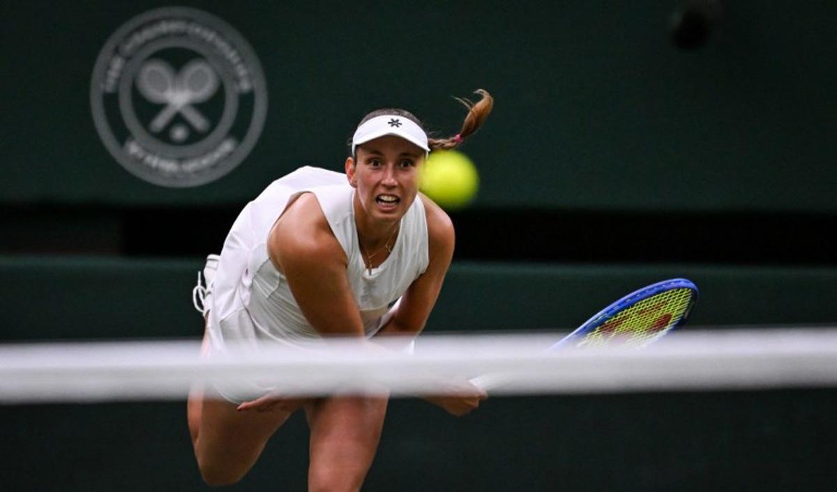 Belgium's Elise Mertens eyes the ball as she returns it to Belarus's Aryna Sabalenka during their women's singles fourth round tennis match on the seventh day of the 2025 Wimbledon Championships at The All England Lawn Tennis and Croquet Club in Wimbledon, southwest London, on July 6, 2025.  Kirill KUDRYAVTSEV / AFP