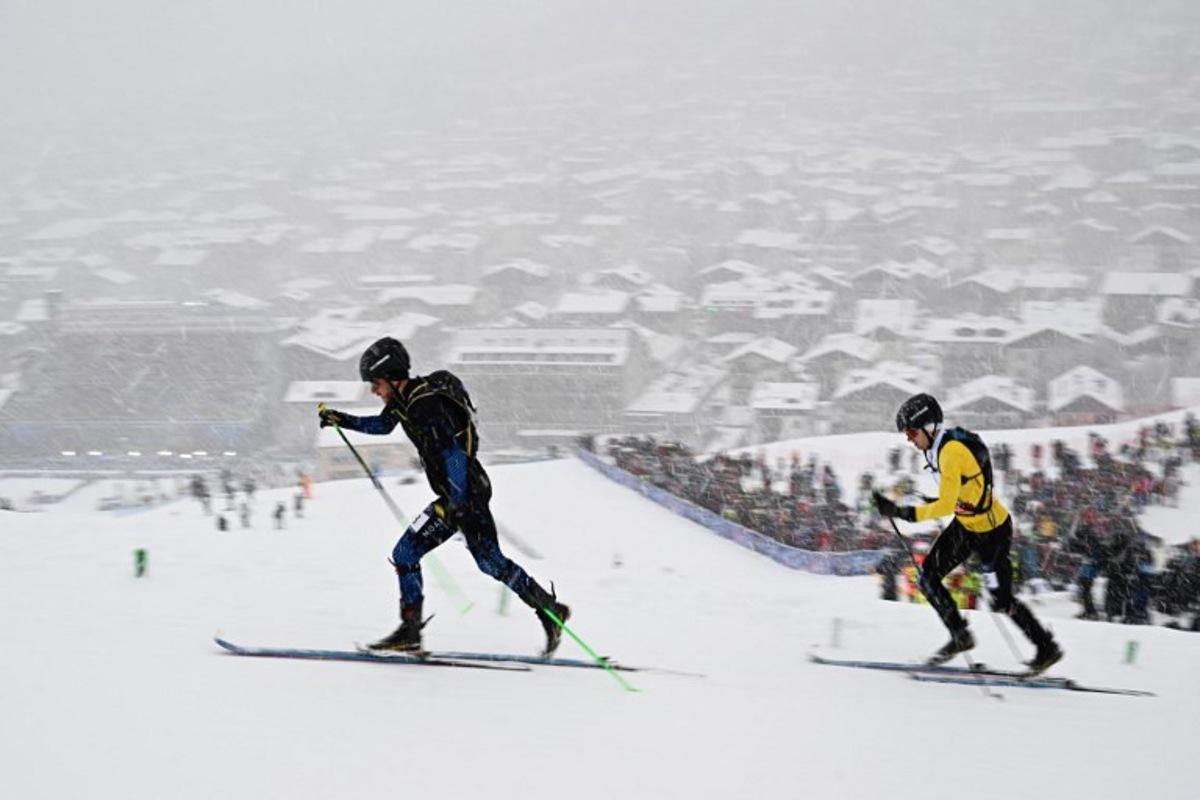 Individual Neutral Athletes' Nikita Filippov (L) and Belgium's Maximilien Drion Du Chapois compete in the men's sprint ski mountaineering heat 2 during the Milano Cortina 2026 Winter Olympic Games at the Stelvio Ski Centre in Bormio (Valtellina) on February 19, 2026.  Fabrice COFFRINI / AFP