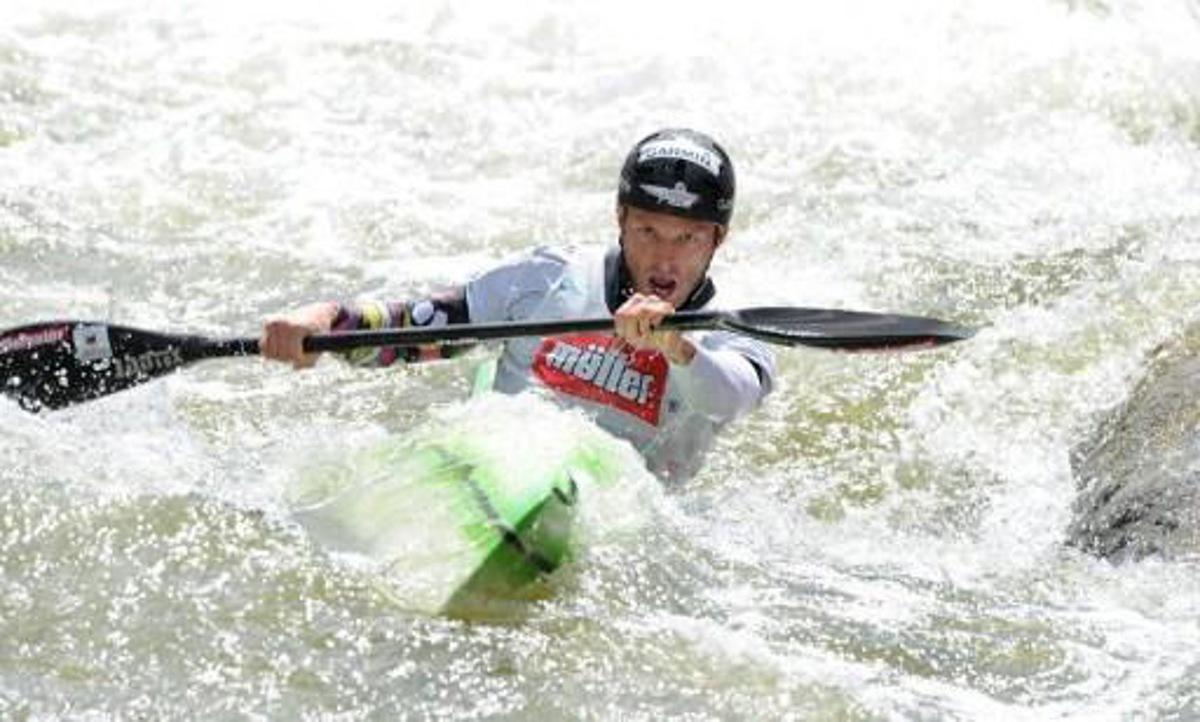 Slovenian Nejc Znidarcic competes in the Kayak K1 men race at the ICF Wildwater Canoeing Sprint World Championships in Augsburg, southern Germany, on June 12, 2011. Znidarcic won the competition ahead of Czech Kamil Mruzek (2nd) and French Remi Pete (3rd). AFP PHOTO/CHRISTOF STACHE