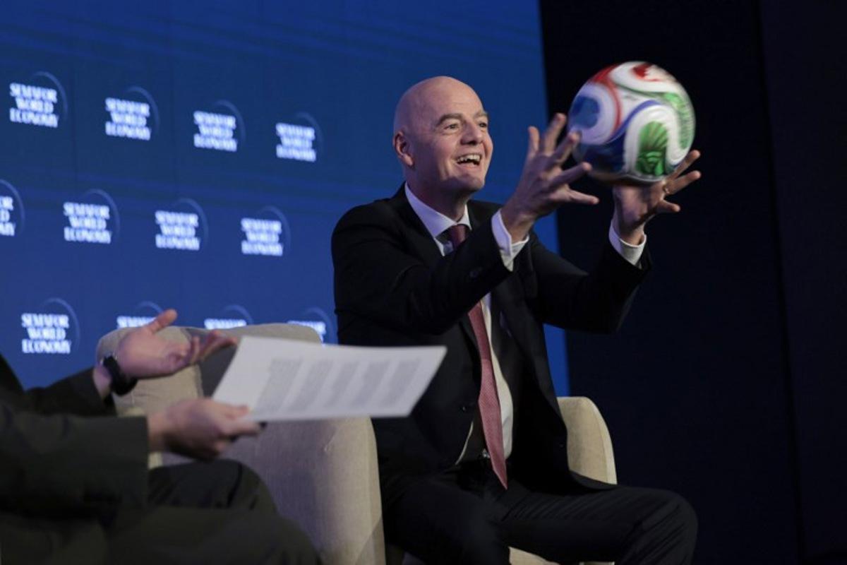 FIFA President Gianni Infantino juggles a foootball while speaking during the 2026 Semafor World Economy conference in Washington, DC, on April 15, 2026.  Kent NISHIMURA / AFP