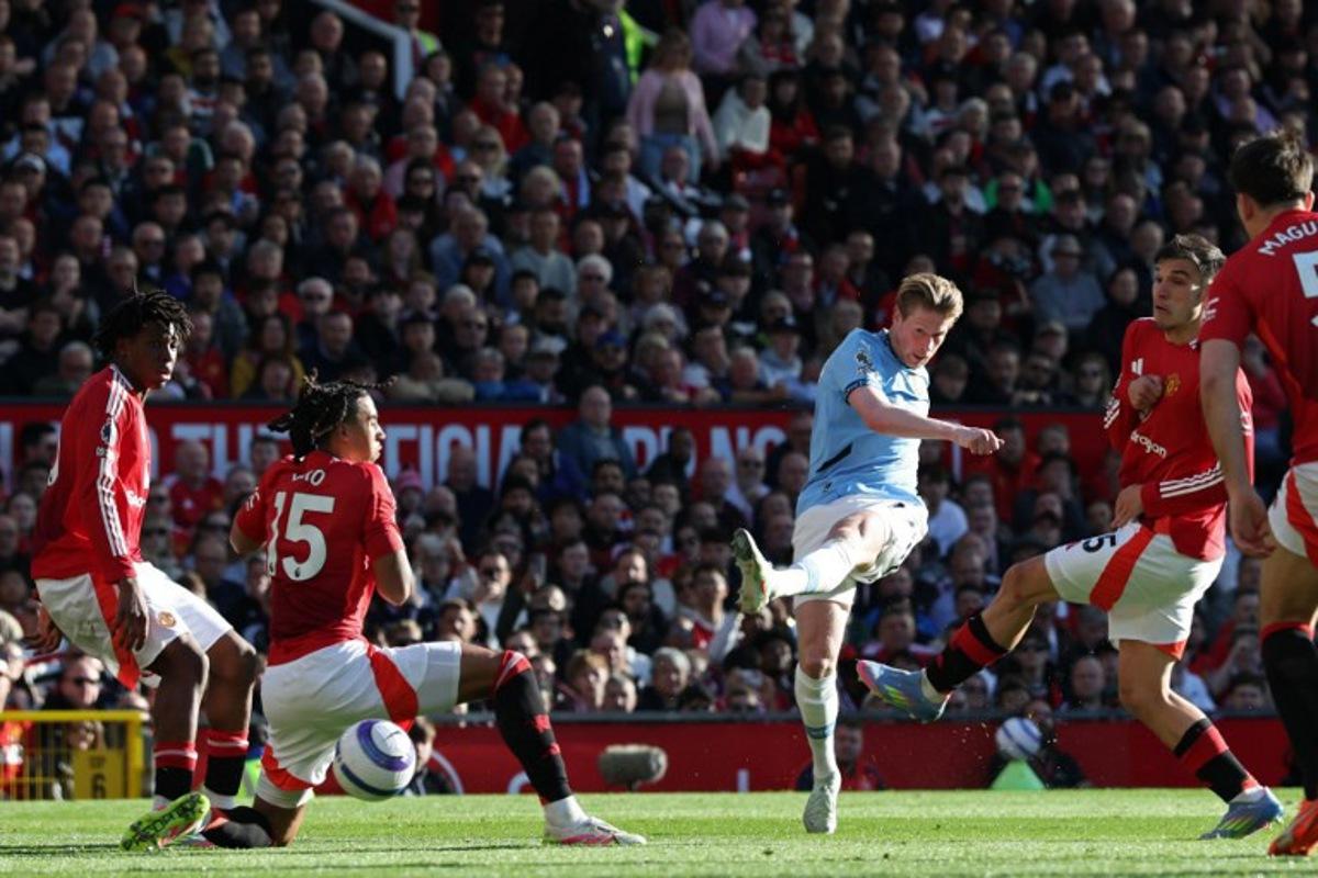 Manchester City's Belgian midfielder #17 Kevin De Bruyne shoots but fails to score during the English Premier League football match between Manchester United and Manchester City at Old Trafford in Manchester, north west England, on April 6, 2025.  Darren Staples / AFP