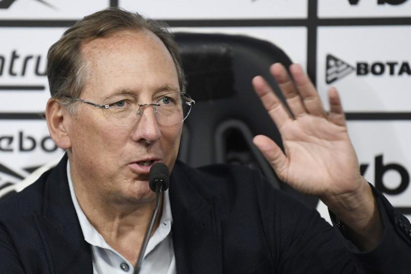 Botafogo's owner John Textor gestures as he speaks to the press during the presentation of Davide Ancelotti as the new head coach of the Botafogo football club in Rio de Janeiro, Brazil on July 14, 2025. Davide, 35, is the son of Brazil's national football team head coach Carlo Ancelotti and worked with his father as assistant coach. Daniel RAMALHO / AFP