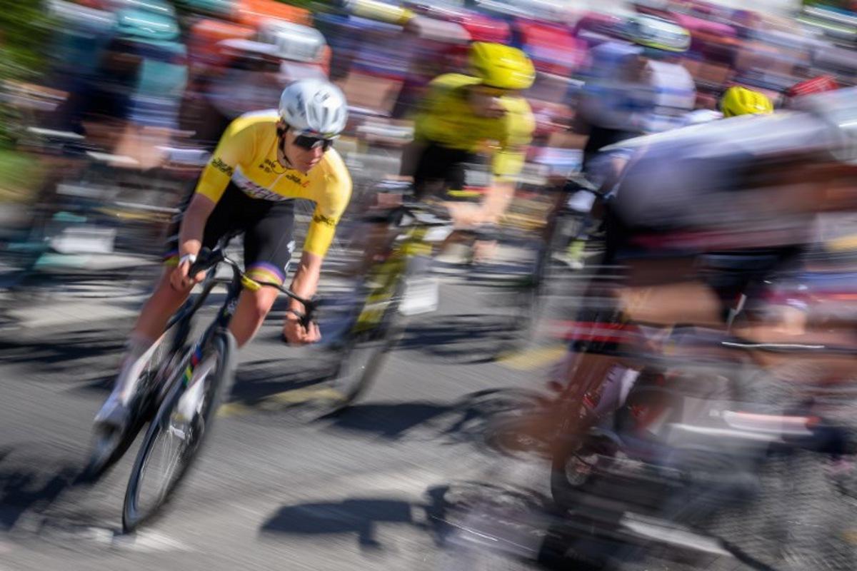UAE Team Emirates-XRG's Slovenian rider Tadej Pogacar wearing the overall leader's yellow jersey rides with the pack during the second stage of the Tour of Romandie UCI cycling World tour, 173.1 km from Rue to Vucherens, in Vucherens, on April 30, 2026.   Fabrice COFFRINI / AFP