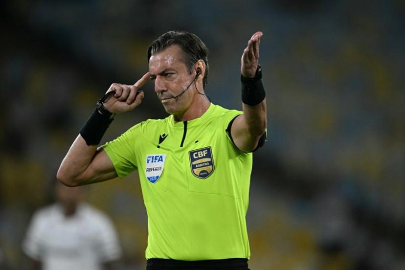 Brazilian referee Raphael Claus gestures during the Brasileirao Serie A football match between Vasco da Gama and Fluminense at the Maracana Stadium in Rio de Janeiro, Brazil, on March 18, 2026.  MAURO PIMENTEL / AFP