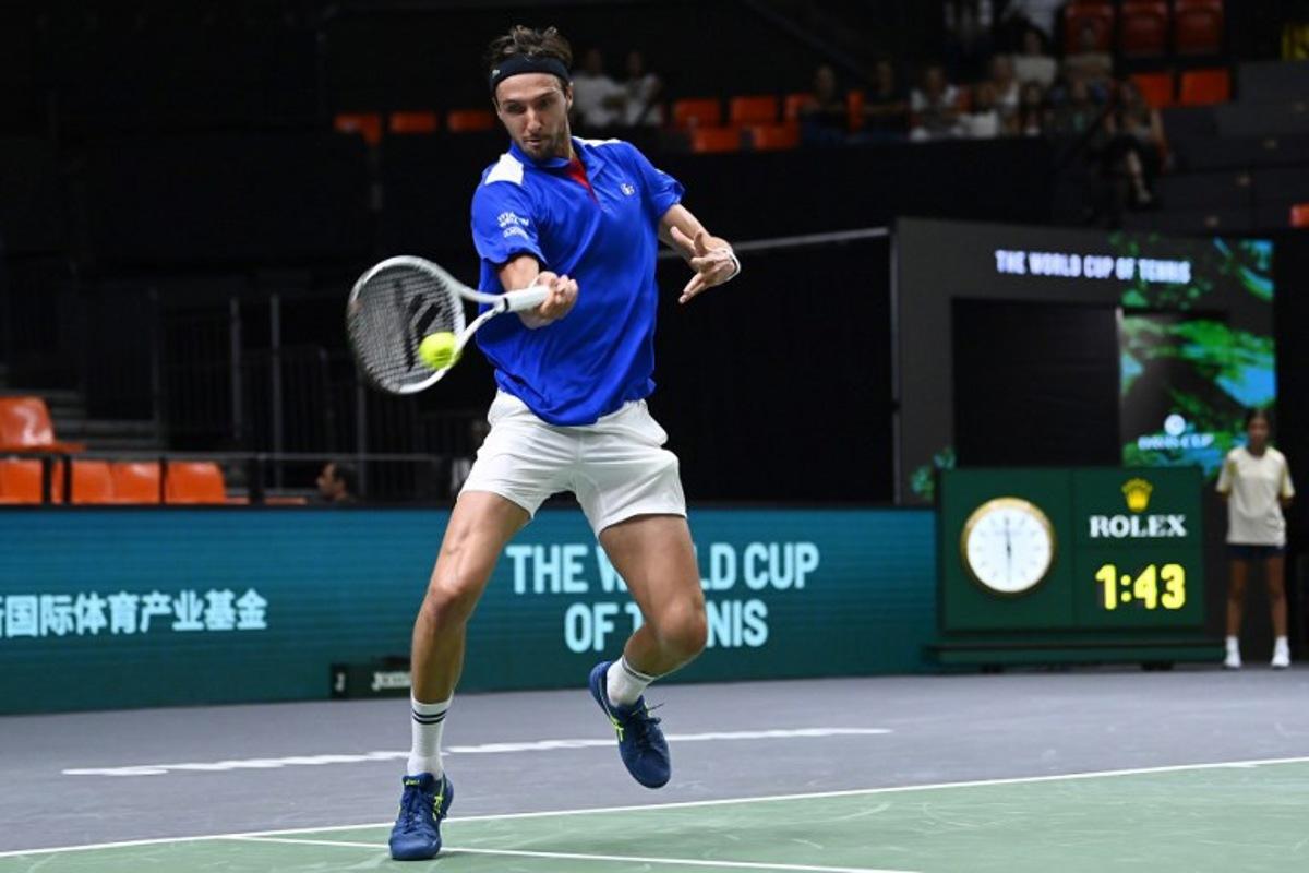 France's Arthur Rinderknech returns a ball against Czech Republic's Jakub Mensik during the group stage men's singles match between Czech Republic and France of the Davis Cup tennis tournament at the Fuente San Luis Sports Hall in Valencia on September 14, 2024.  JOSE JORDAN / AFP