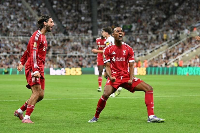 Liverpool's Dutch midfielder #38 Ryan Gravenberch (C) celebrates after scoring the opening goal of the English Premier League football match between Newcastle United and Liverpool at St James' Park in Newcastle-upon-Tyne, north east England on August 25, 2025.  ANDY BUCHANAN / AFP
