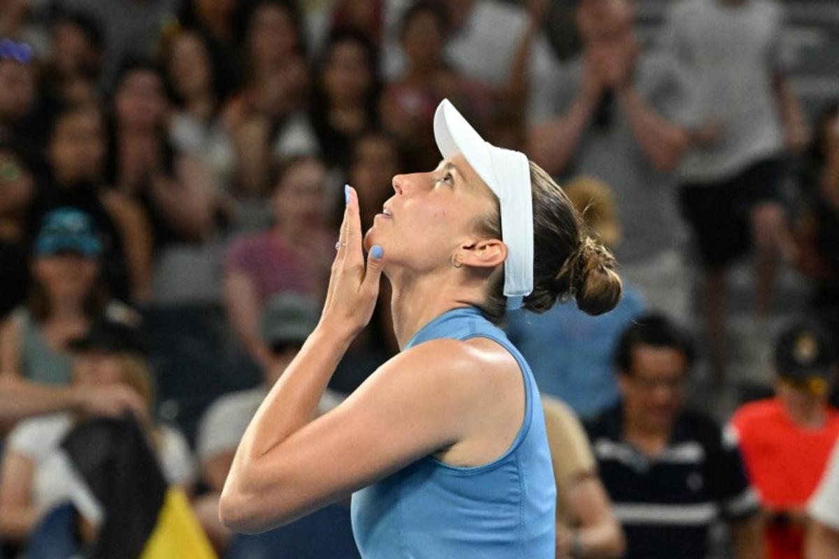 Belgium's Elise Mertens celebrates after victory against Czech Republic's Nikola Bartunkova during their women's singles match on day seven of the Australian Open tennis tournament in Melbourne on January 24, 2026.  Paul Crock / AFP