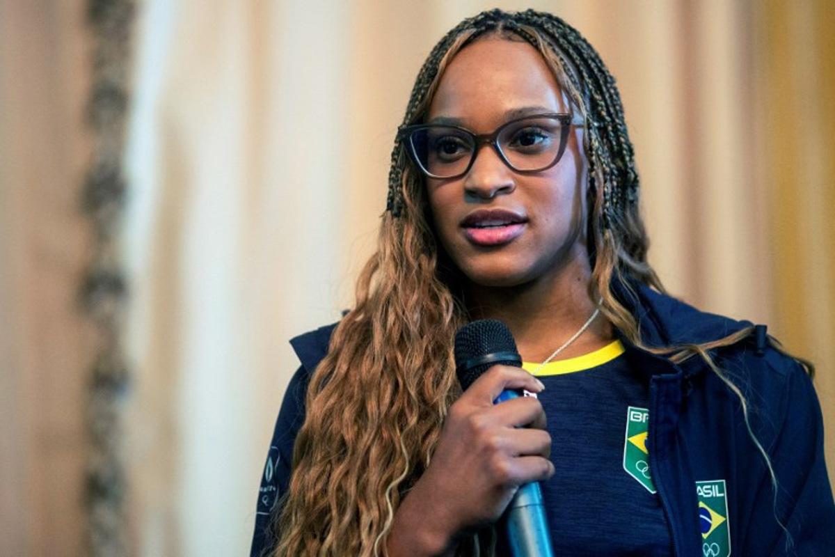 Brazil's olympic champion Rebeca Andrade speaks during a welcome ceremony for the olympic athletes at Rio de Janeiro Mayor's office, in Rio de Janeiro, Brazil, on August 15, 2024.   Daniel RAMALHO / AFP