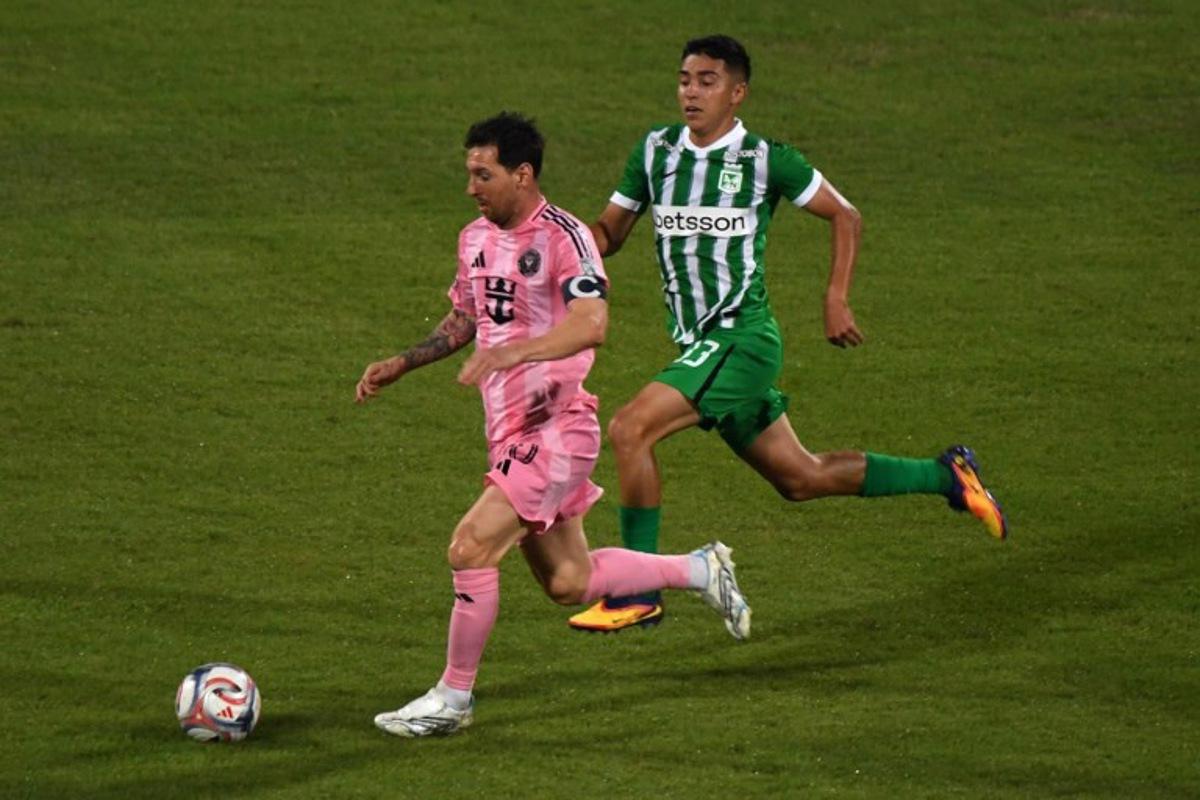 Inter Miami's Argentine forward #10 Lionel Messi and Atletico Nacional's defender #33 Royer Caicedo fight for the ball during the friendly football match between Colombia's Atletico Nacional and the US' Inter Miami at the Atanasio Girardot Stadium in Medellin, Colombia, on January 31, 2026.  Jaime SALDARRIAGA / AFP