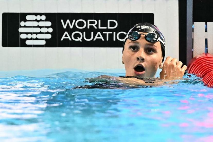 Canada's swimmer Summer Mcintosh reacts after winning the final of the women's 400m freestyle swimming event during the 2025 World Aquatics Championships in Singapore on July 27, 2025.  MANAN VATSYAYANA / AFP