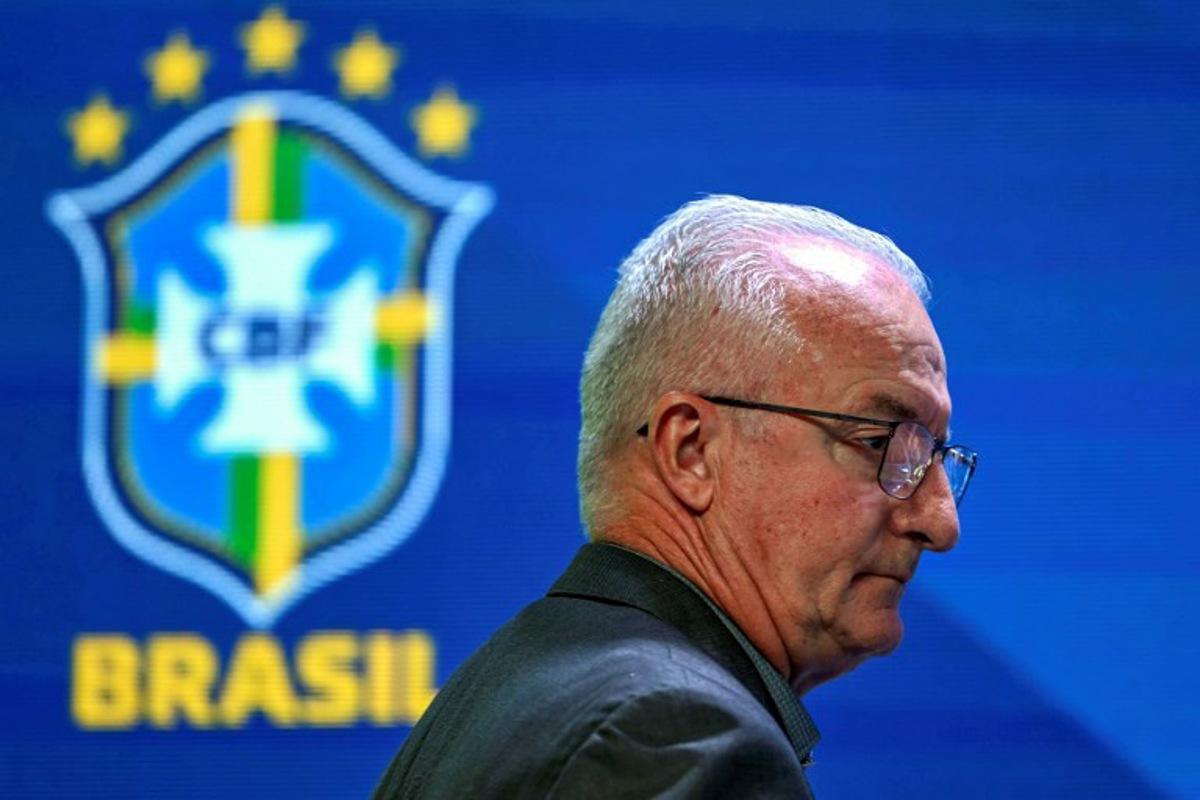 (FILES) Brazil's national football team head coach, Dorival Junior, arrives at a press conference in Rio de Janeiro, Brazil on August 23, 2024. The Brazilian Football Confederation (CBF) announced on March 28, 2025 the dismissal of coach Dorival Junior after the Seleçao suffered a historic 4-1 drubbing by Argentina on the last day of the world Cup South American qualifiers. The five-time champions conceded four goals for the first time in a pre-World Cup match, a blow that sealed the fate of the 62-year-old coach, who had taken over in January 2024. Mauro PIMENTEL / AFP