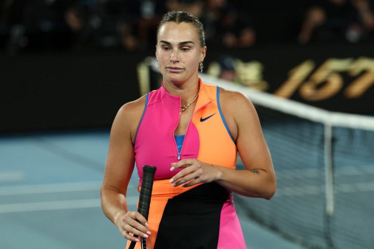 Belarus' Aryna Sabalenka reacts after defeat against Kazakhstan's Elena Rybakina during their women's singles final match on day fourteen of the Australian Open tennis tournament in Melbourne on January 31, 2026.  IZHAR KHAN / AFP
