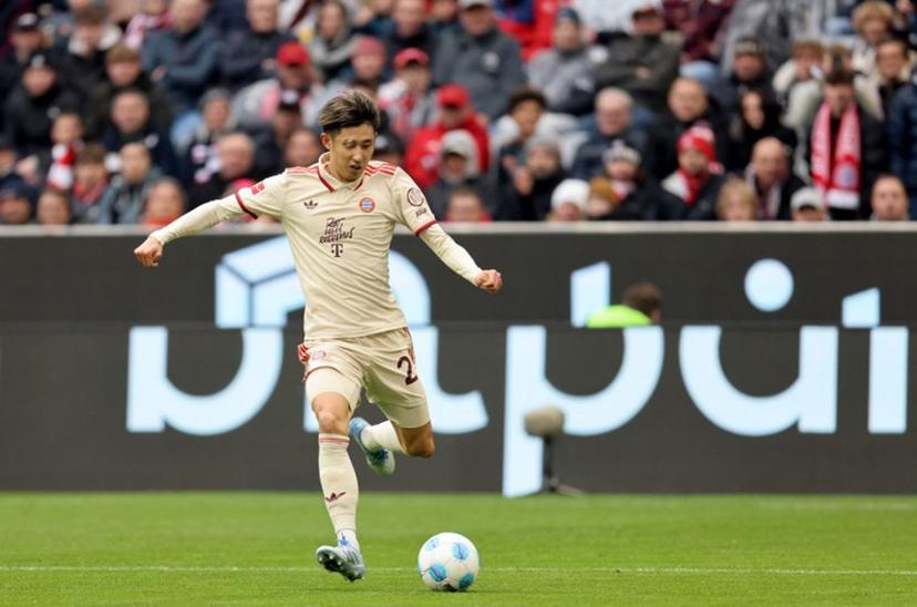 Bayern Munich's Japanese defender #21 Hiroki Ito plays the ball during the German first division Bundesliga football match between FC Bayern Munich and St Pauli in Munich, southern Germany on March 29, 2025.  Alexandra BEIER / AFP