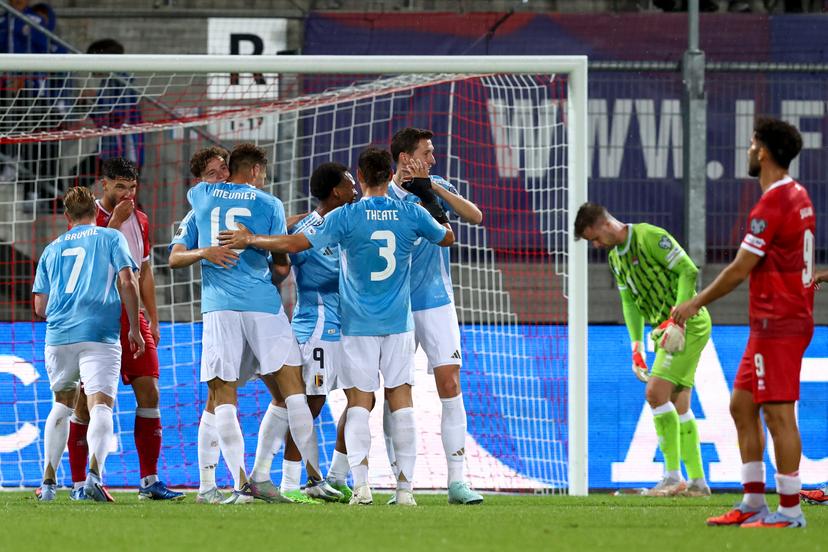 Belgium's Maxim De Cuyper and Belgium's Thomas Meunier celebrate after scoring during pictured during a soccer game between Belgian national soccer team Red Devils and Liechtenstein, in Vaduz, on Thursday 04 September 2025, the third (out of 8) qualification game for the World Cup 2026. BELGA PHOTO BRUNO FAHY