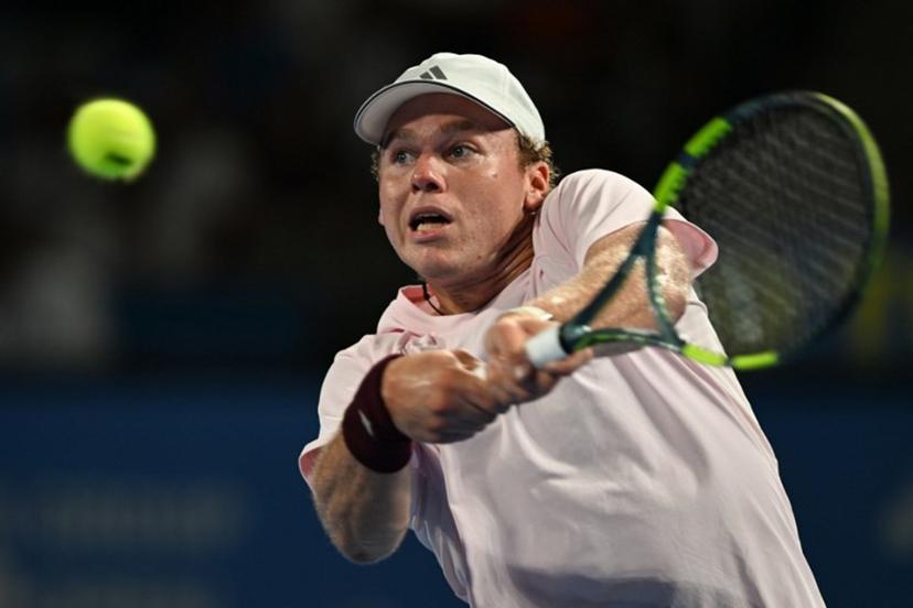 USA's Alex Michelsen plays a shot to Spain's Carlos Alcaraz during their men's singles tennis match at the ATP Tour Japan Open Tennis Championships at the Ariake Tennis Forest Park in Tokyo on October 1, 2026.  Rie KIKUCHI / AFP