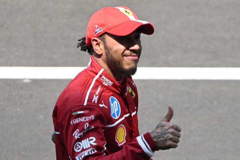 Ferrari's British driver Lewis Hamilton celebrates after winning the sprint race of the Formula One Chinese Grand Prix at the Shanghai International Circuit in Shanghai on March 22, 2025.  JADE GAO / AFP