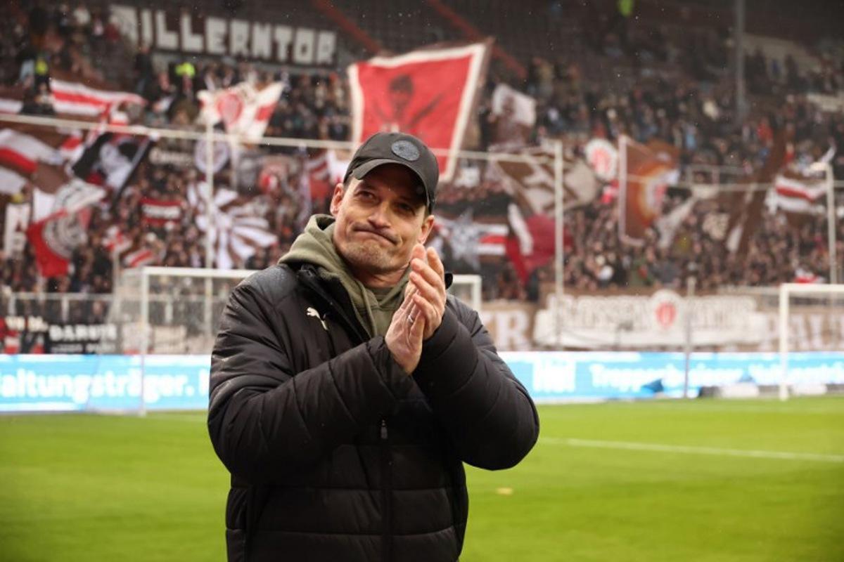 St Pauli's German head coach Alexander Blessin reacts prior to the German first division Bundesliga football match between St Pauli and VfB Stuttgart in Hamburg, northern Germany, on February 7, 2026.  Ibrahim OT / AFP