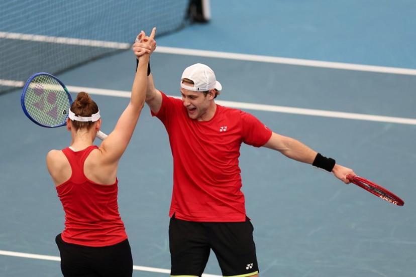Belgium's Zizou Bergs (R) and Elise Mertens celebrate after winning their mixed double games against Canada's Cleeve Harper and Victoria Mboko at the United Cup tennis tournament on Ken Rosewall Arena in Sydney on January 6, 2026.  Izhar KHAN / AFP