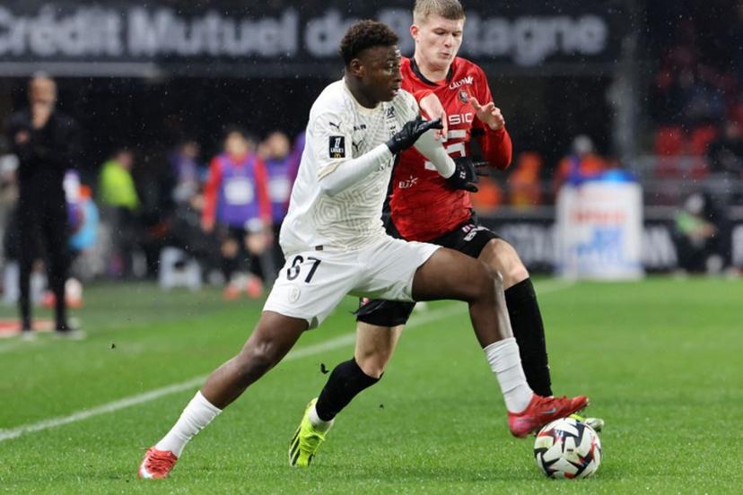 Reims' French forward #67 Mamadou Diakhon (L) fights for the ball with Rennes' Welsh midfielder #17 Jordan James during the French L1 football match between Rennes and Reims at the Roazhon Park stadium in Rennes, western France, on February 21, 2025.  Fred TANNEAU / AFP