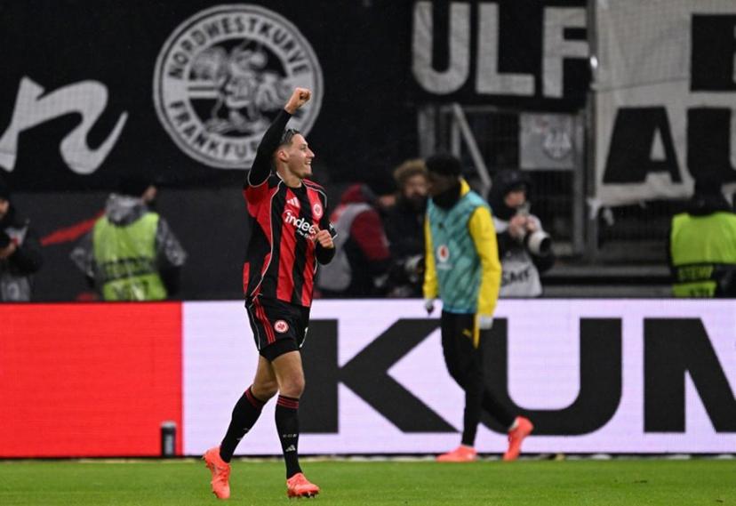 Frankfurt's German forward #11 Younes Ebnoutalib celebrates scoring the 2-2 goal during the German first division Bundesliga football match between Eintracht Frankfurt and BVB Borussia Dortmund in Frankfurt am Main, western Germany, on January 9, 2026.  Kirill KUDRYAVTSEV / AFP