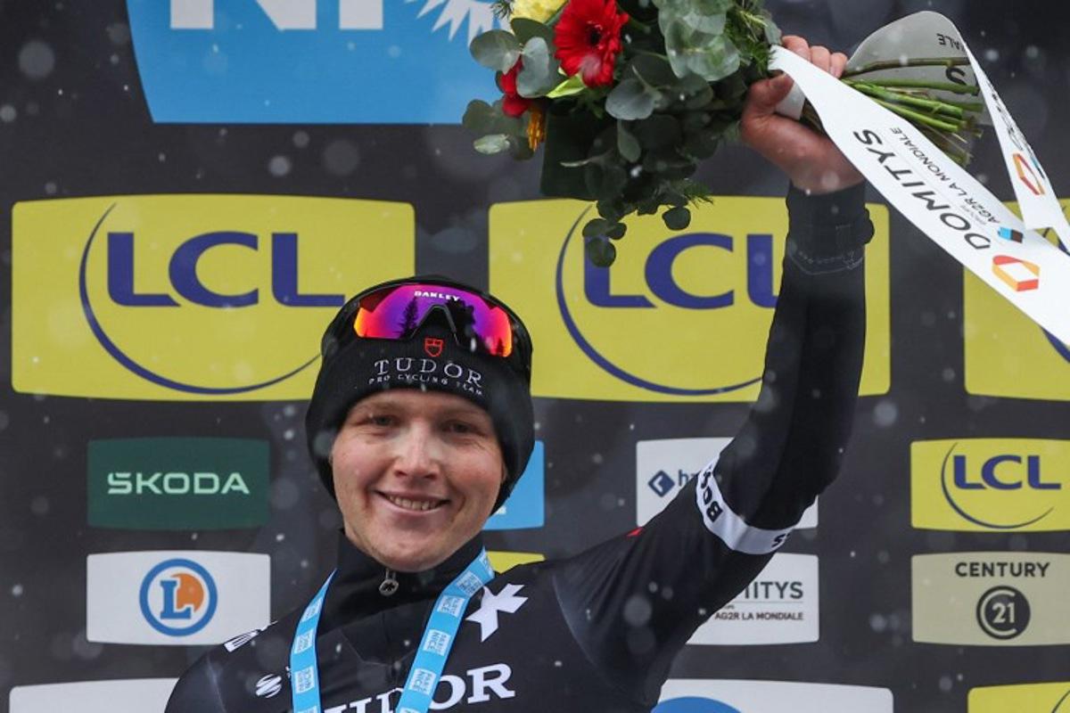 Tudor Pro Cycling Team's Australian rider Michael Storer celebrates on the podium after winning the 7th stage of the Paris-Nice cycling race, 109,3 km between Nice and Auron, on March 15, 2025.  Anne-Christine POUJOULAT / AFP