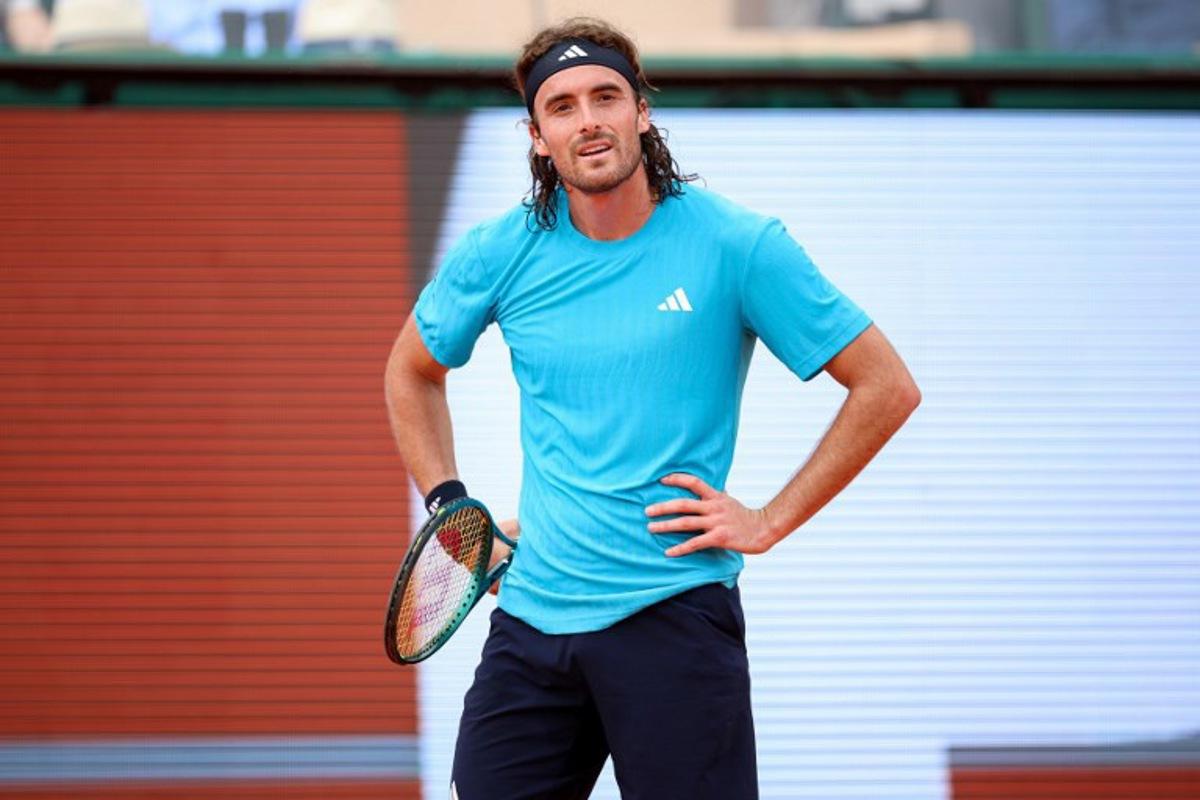 Greece's Stefanos Tsitsipas reacts as he plays against Argentinia's Francisco Cerundolo during the Monte Carlo ATP Masters Series Tournament round of 64 tennis match on Court Rainier III at the Monte-Carlo Country Club in Roquebrune-Cap-Martin, south-eastern France on April 6, 2026.  Valery HACHE / AFP