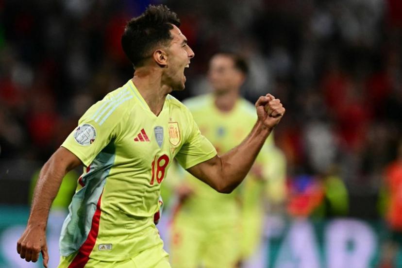 Spain's midfielder #18 Martin Zubimendi celebrates scoring the opening goal with his teammates during the UEFA Nations League final football match between Portugal and Spain in Munich, southern Germany on June 8, 2025.  Tobias SCHWARZ / AFP