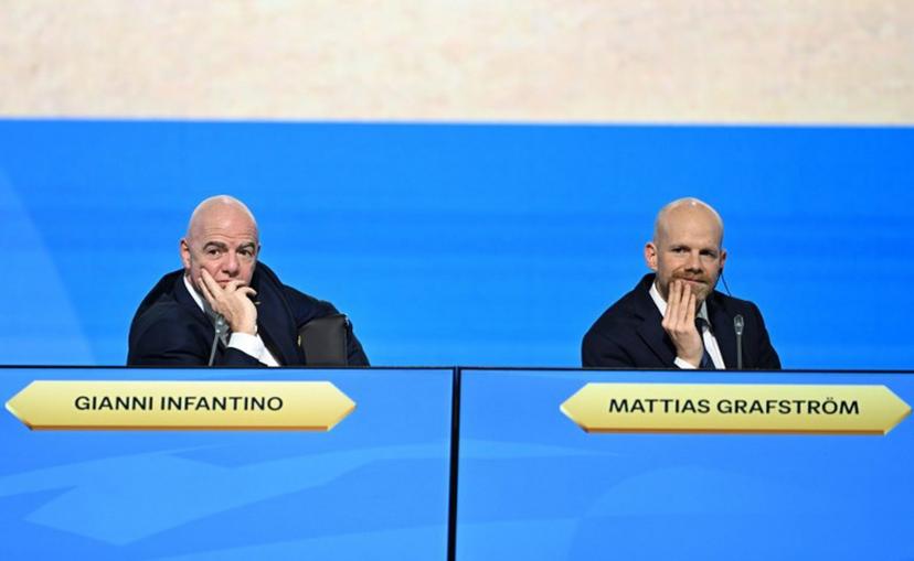 FIFA President Gianni Infantino (L) and FIFA Secretary-General Mattias Grafstrom (R) attend the 74th FIFA Congress in Bangkok on May 17, 2024. The 74th FIFA Congress is taking place in Bangkok with member associations voting on a range of issues including confirmation of the host nation or nations for the 2027 women's football World Cup. Manan VATSYAYANA / AFP
