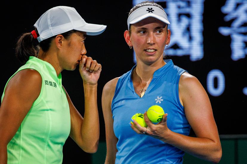 Belgium's Elise Mertens (blue) and Chinese Shuai Zhang (yellow) pictured during a tennis match between US pair Baptiste/Stearns and Belgian/ Chinese pair Mertens/Zhang, in the 1/8 final of the women doubles at the Australian Open, in Melbourne Park, Melbourne on Tuesday 27 January 2026.  BELGA PHOTO PATRICK HAMILTON  --- BENELUX ONLY   ---
