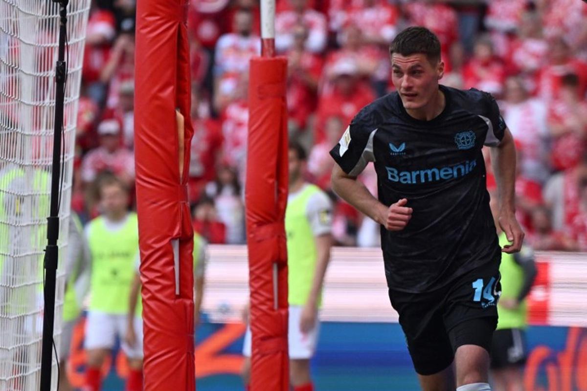 Bayer Leverkusen's Czech forward #14 Patrik Schick celebrates after scoring his team's second goal during the German first division Bundesliga football match between Mainz 05 and Bayer Leverkusen in Mainz, western Germany, on May 17, 2025.  Kirill KUDRYAVTSEV / AFP