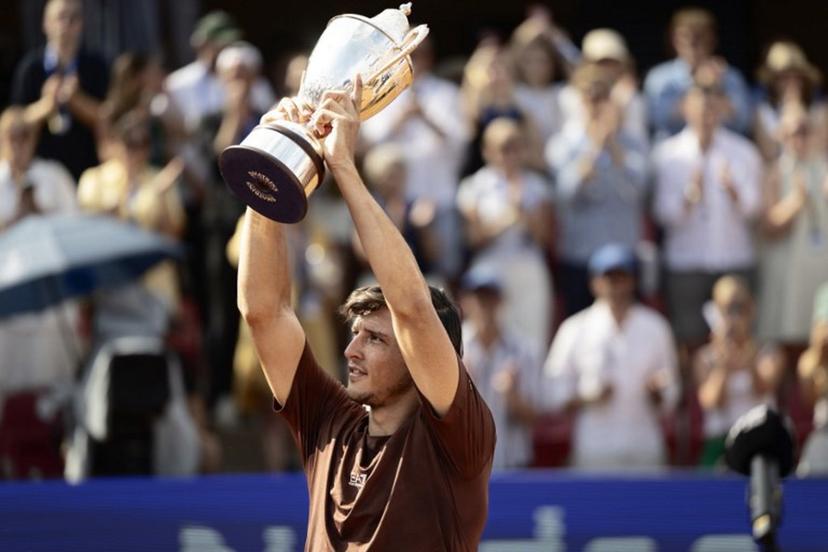 Italy's Luciano Darderi poses with the trophy after winning the men's singles final match against Netherlands' Jesper de Jong (not pictured) atthe ATP Nordea Open tennis tournament in Bastad, Sweden, on July 20, 2025.  Bjorn LARSSON ROSVALL / TT News Agency / AFP
