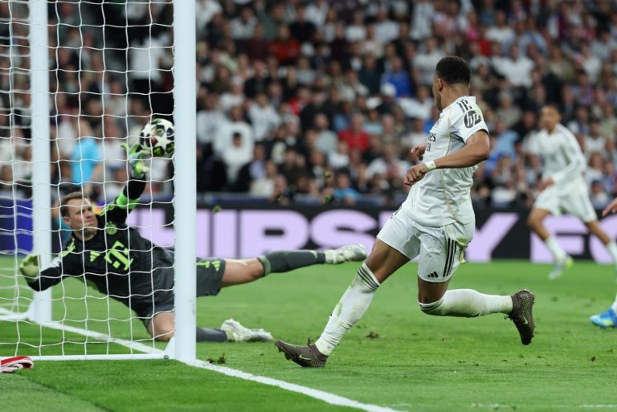 Real Madrid's French forward #10 Kylian Mbappe scores his team's first goal during the UEFA Champions League quarter final first leg football match between Real Madrid CF and FC Bayern Munich at Santiago Bernabeu Stadium in Madrid on April 7, 2026.  Thomas COEX / AFP