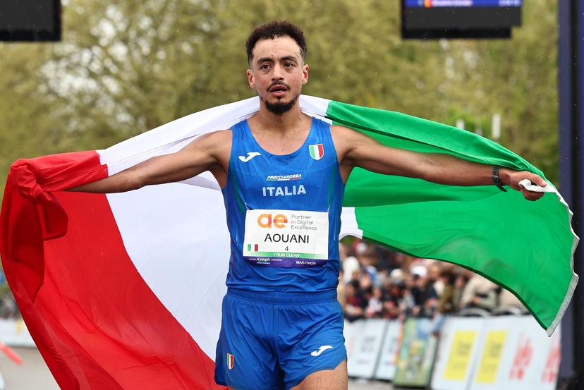 Italian Aouani Iliass celebrates as he won the men marathon race at European Running Championships, from Leuven to Brussels, Sunday 13 April 2025.  BELGA PHOTO DAVID PINTENS