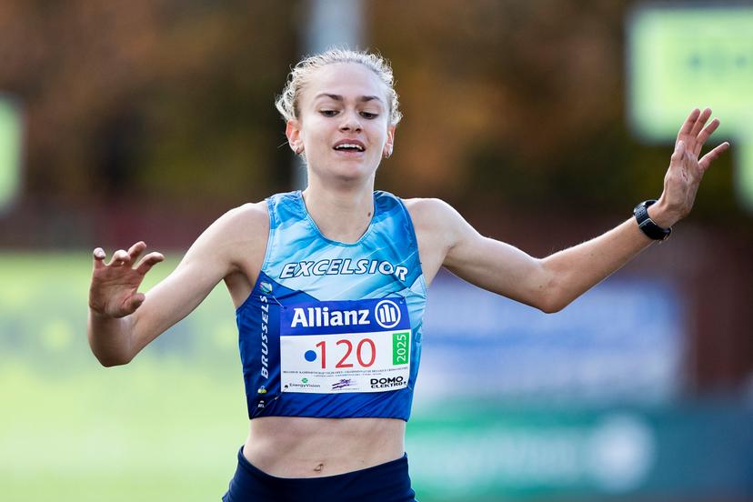 Belgian Jana Van Lent celebrates as she crosses the finish line to win the women elite race of the CrossCup cross country running athletics event in Hulshout, the third stage of the CrossCup competition and the Belgian Championships, Sunday 17 November 2024. BELGA PHOTO KRISTOF VAN ACCOM