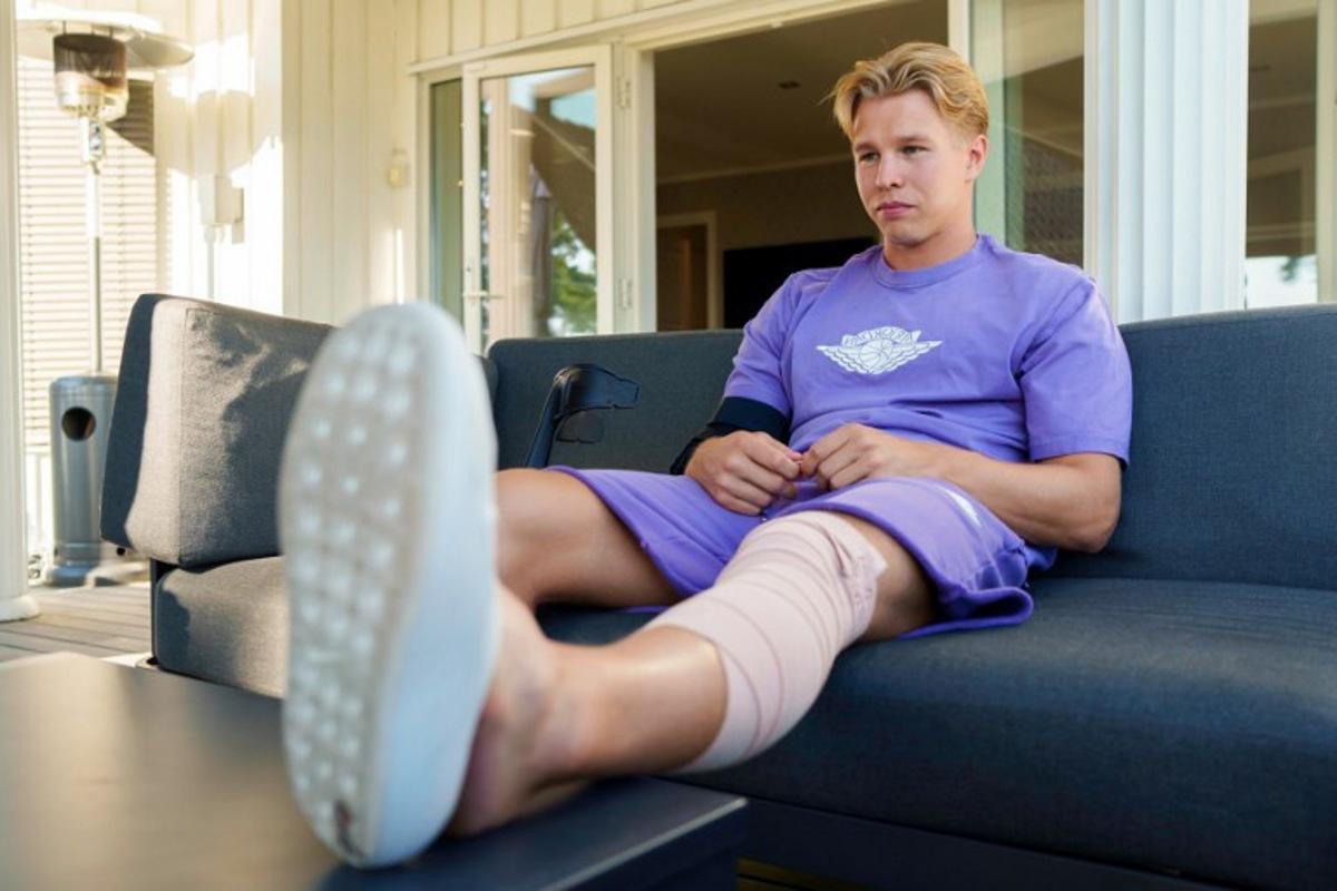 Norway's Olympic decathlon champion Markus Rooth sits with his leg up in Oslo on Augist 25, 2025 after he injured himself during pole vault training and will miss the upcoming World Athletics Championships in Tokyo.    Cornelius Poppe / NTB / AFP