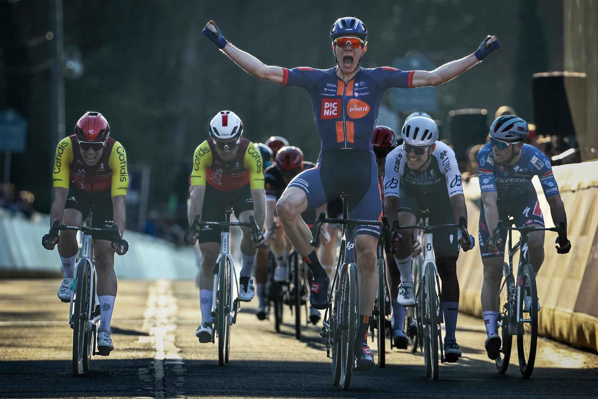 Dutch Nils Eekhoff of Team Picnic PostNL celebrates as he crosses the finish line to win the 'Nokere Koerse' one day cycling race for men elite, 188.1 km from Deinze to Nokere, on Wednesday 19 March 2025. BELGA PHOTO DAVID PINTENS